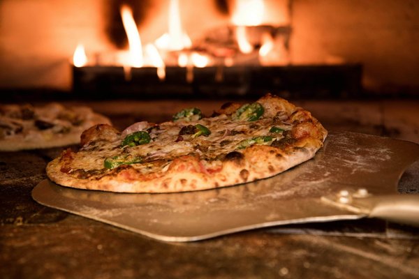 What are the top considerations for UK homeowners when installing an outdoor pizza oven?